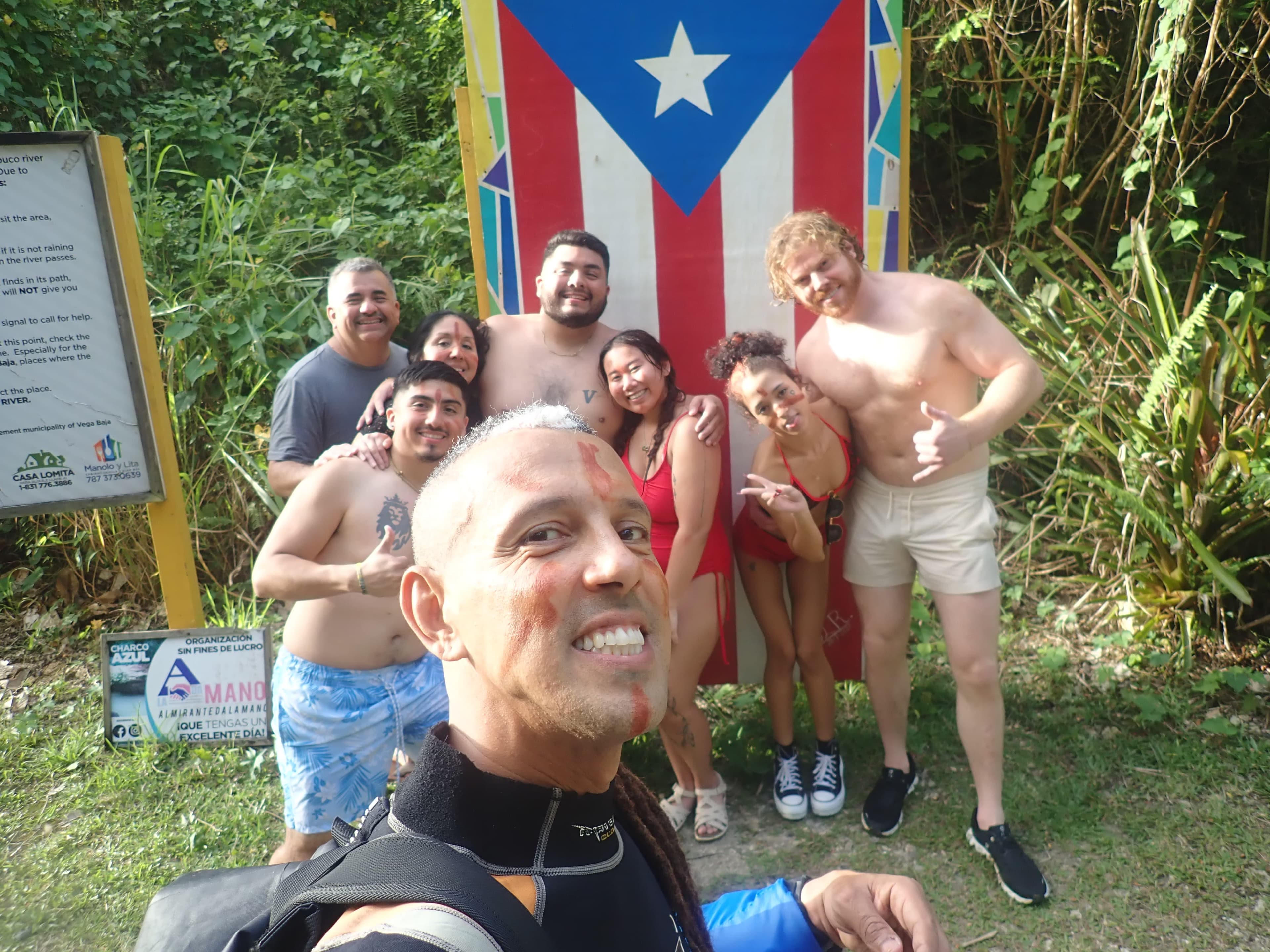 Tour group at the Charco Azul sign