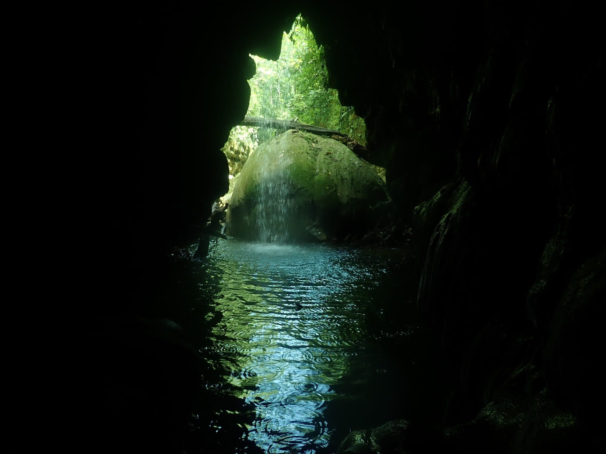 Waterfall seen from inside a river cave