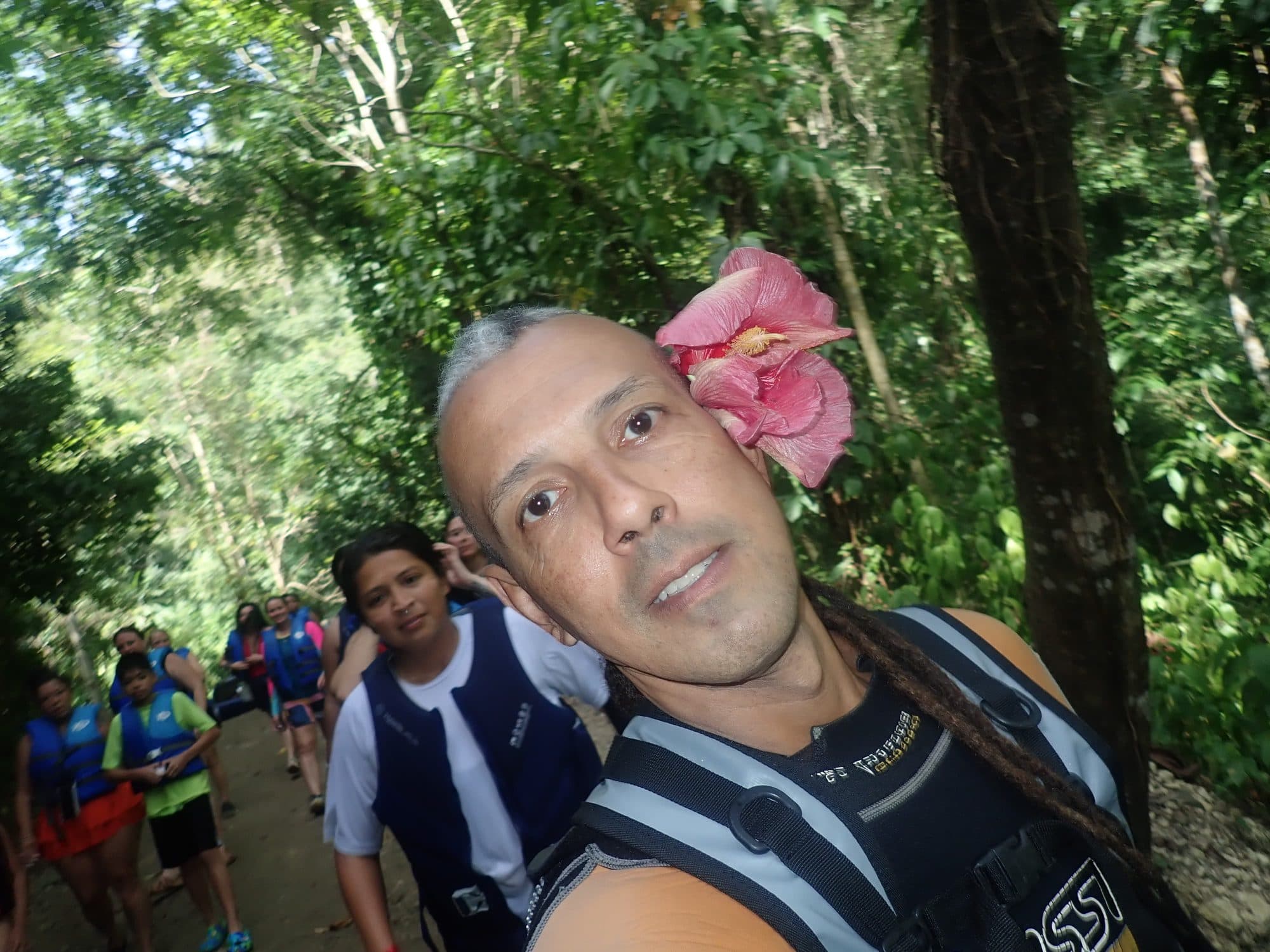 Jesús taking a selfie with his group on the forest trail