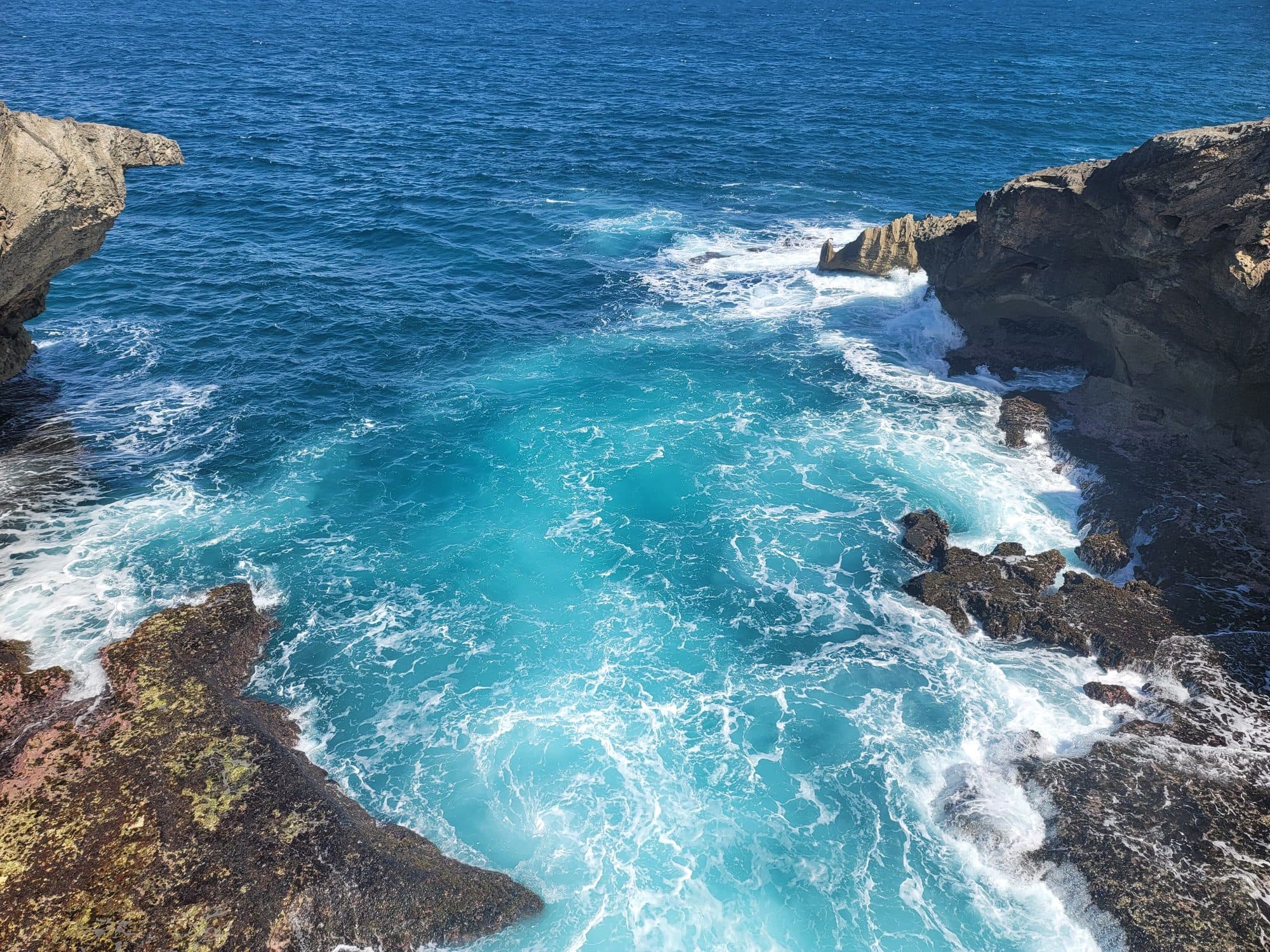 Turquoise Atlantic surf in a limestone channel